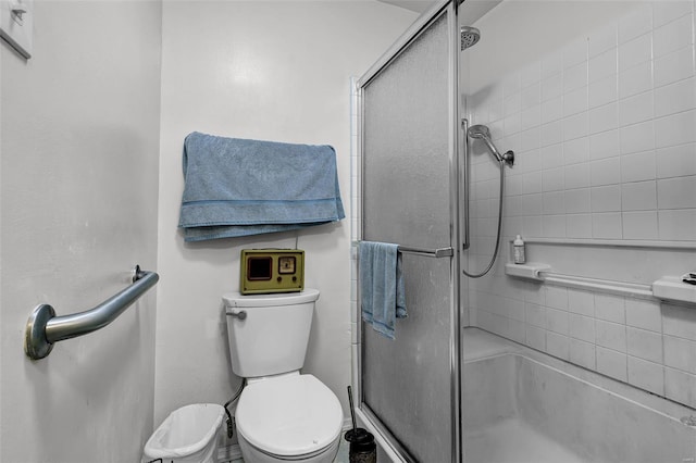 full bathroom with toilet and a shower stall