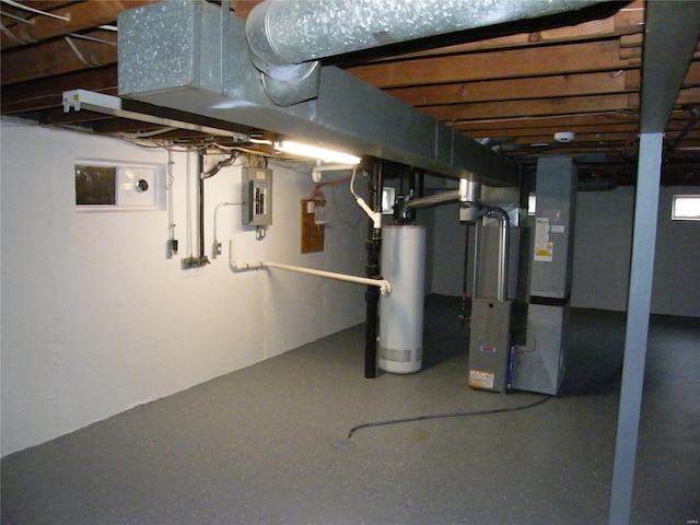 unfinished basement featuring water heater and electric panel