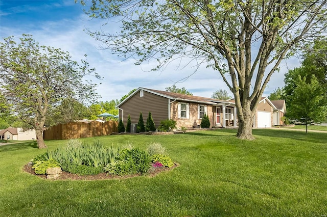 single story home with fence, a garage, and a front yard