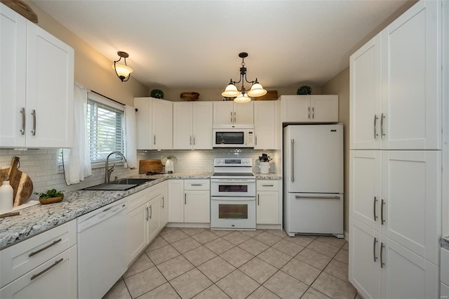 kitchen featuring backsplash, a sink, white cabinets, white appliances, and light tile patterned flooring