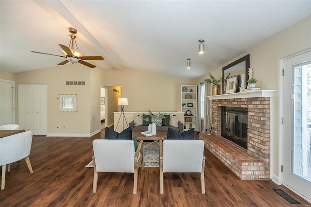 dining space with ceiling fan, visible vents, vaulted ceiling with beams, and dark wood-type flooring