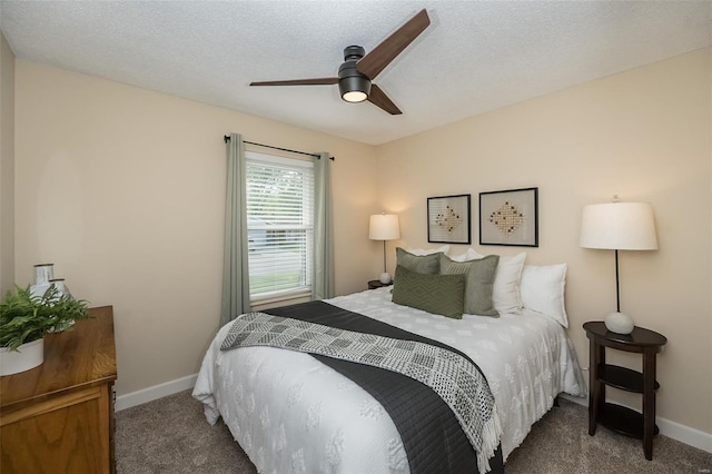 carpeted bedroom with baseboards and ceiling fan