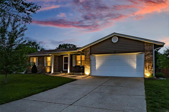ranch-style home featuring concrete driveway, brick siding, an attached garage, and a front yard
