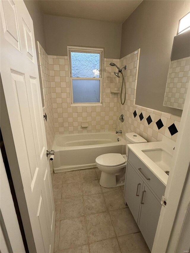full bathroom featuring vanity, tile patterned flooring, toilet, and tub / shower combination