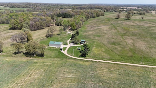 birds eye view of property with a rural view