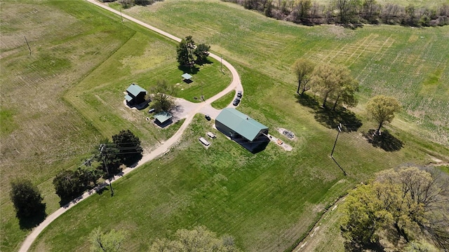 birds eye view of property with a rural view