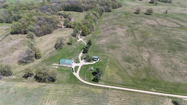 birds eye view of property with a rural view