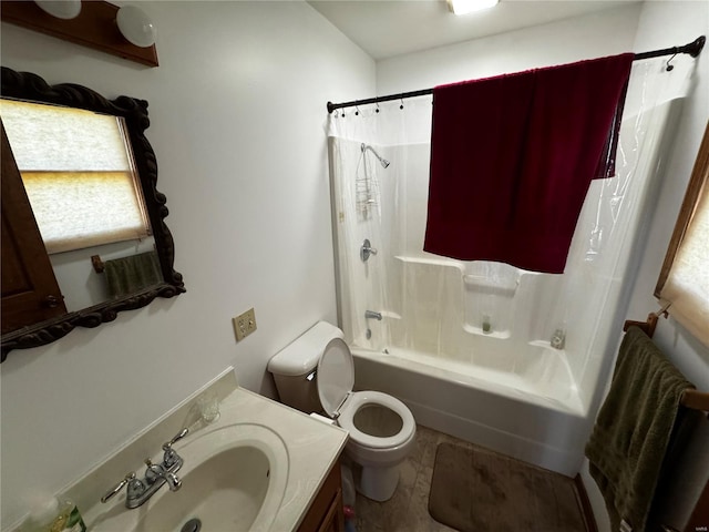 full bathroom featuring toilet, shower / bathtub combination with curtain, and vanity