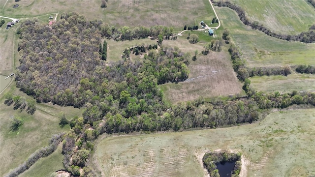 birds eye view of property featuring a rural view