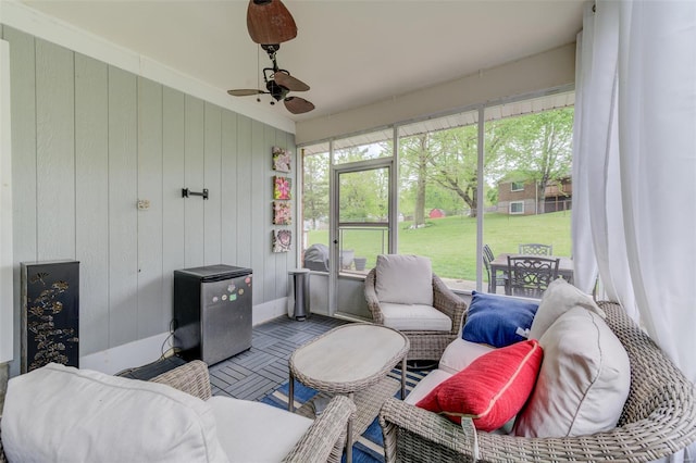 sunroom / solarium with ceiling fan