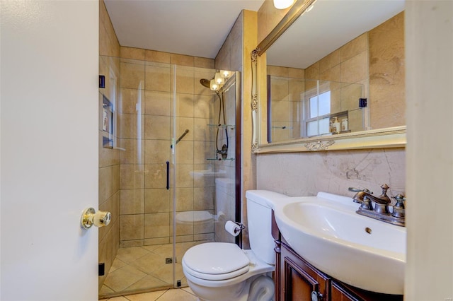 bathroom featuring vanity, toilet, and a shower stall