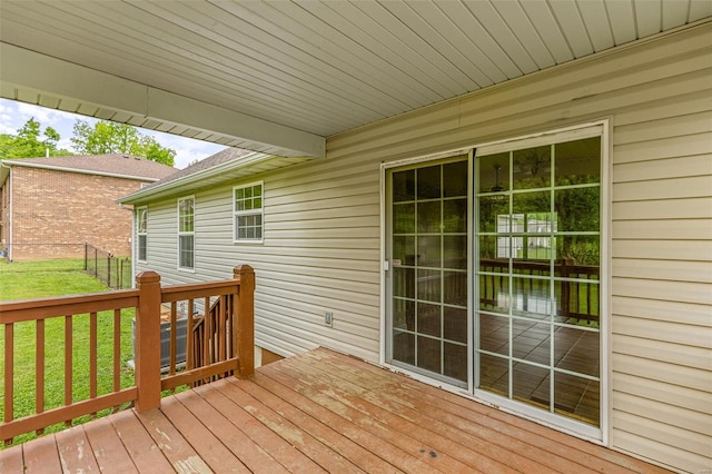 wooden deck with a yard