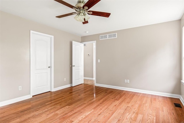 unfurnished bedroom with light wood-style floors, visible vents, and baseboards
