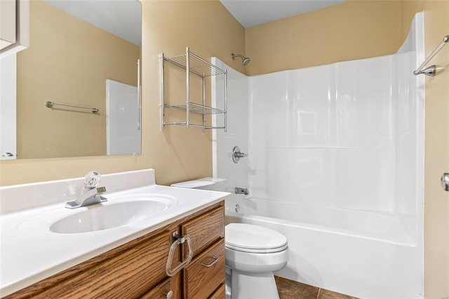 bathroom featuring bathing tub / shower combination, toilet, tile patterned flooring, and vanity