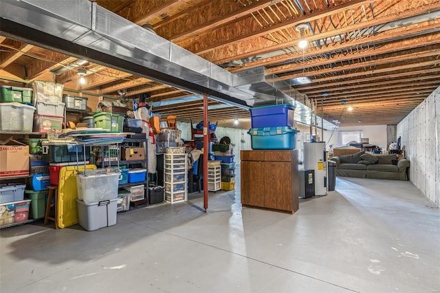 unfinished basement featuring electric water heater