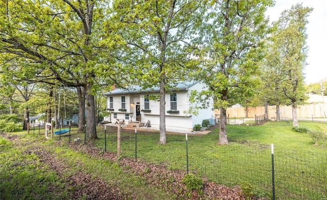 exterior space with a lawn and fence