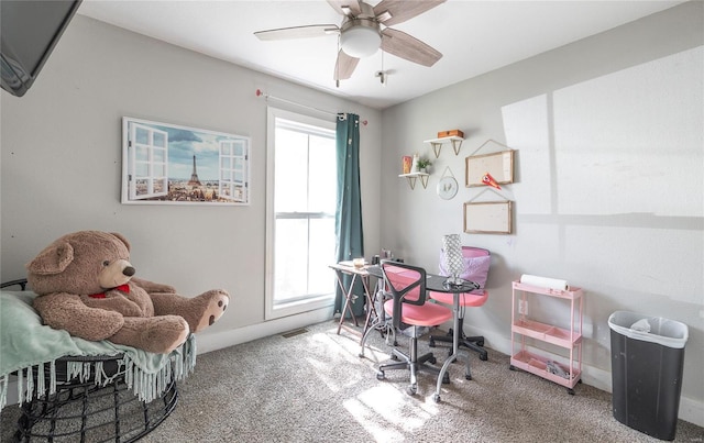 office area with carpet flooring, ceiling fan, and baseboards