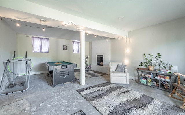 interior space with baseboards, a fireplace, and pool table