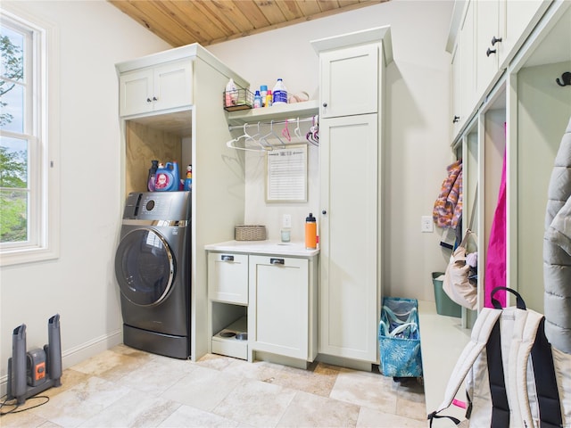 washroom with cabinet space, baseboards, washer / dryer, and wood ceiling