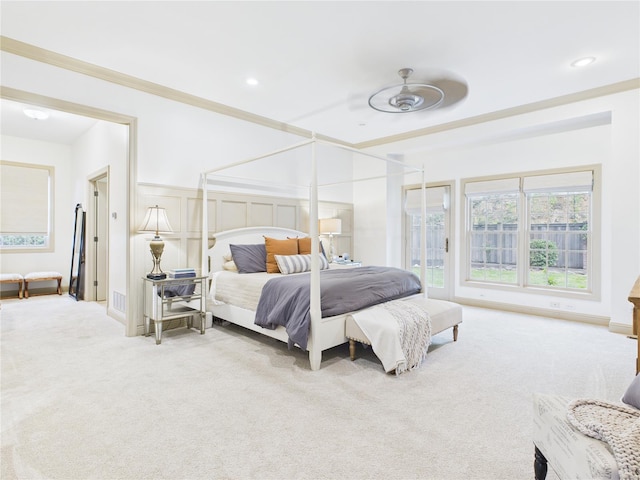 bedroom with crown molding, recessed lighting, and carpet