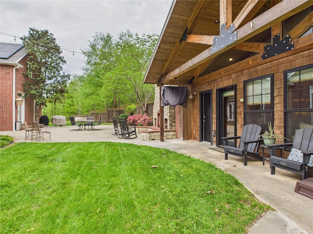 view of yard with a patio and fence