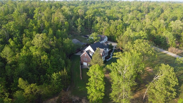 birds eye view of property with a wooded view