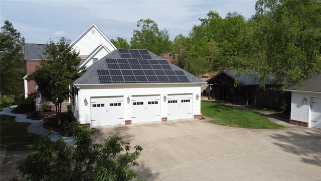 garage with roof mounted solar panels