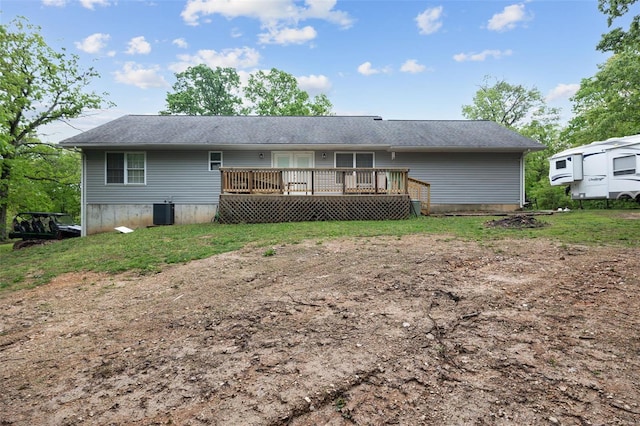 rear view of property featuring central air condition unit and a deck