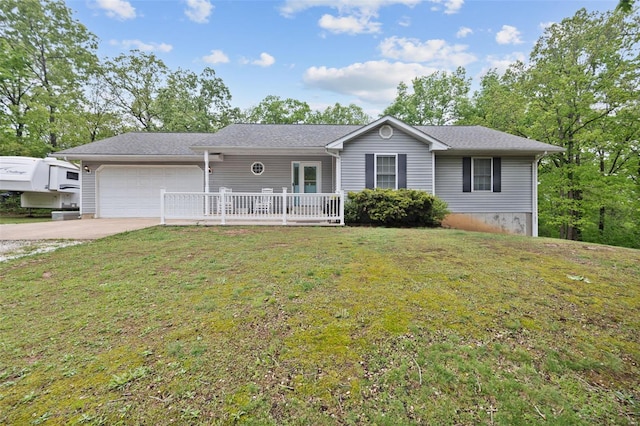 ranch-style home with an attached garage, concrete driveway, and a front lawn