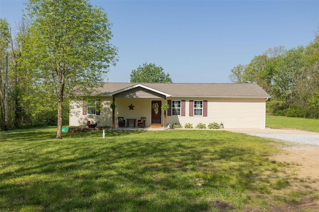 ranch-style home featuring driveway and a front yard
