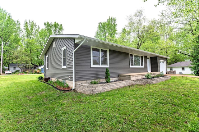 view of front of house with a garage and a front yard