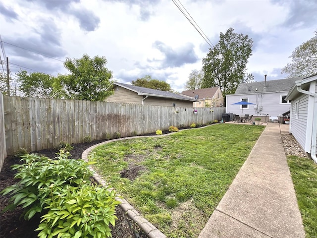 view of yard with a fenced backyard and a patio area