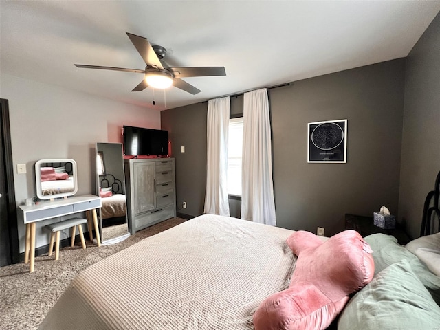 bedroom with ceiling fan and carpet floors