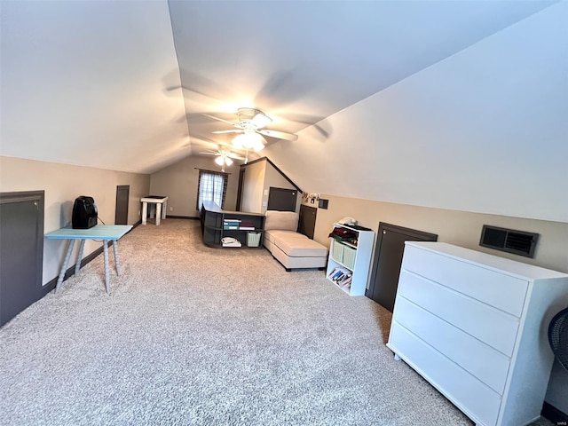carpeted bedroom with lofted ceiling, visible vents, and a ceiling fan