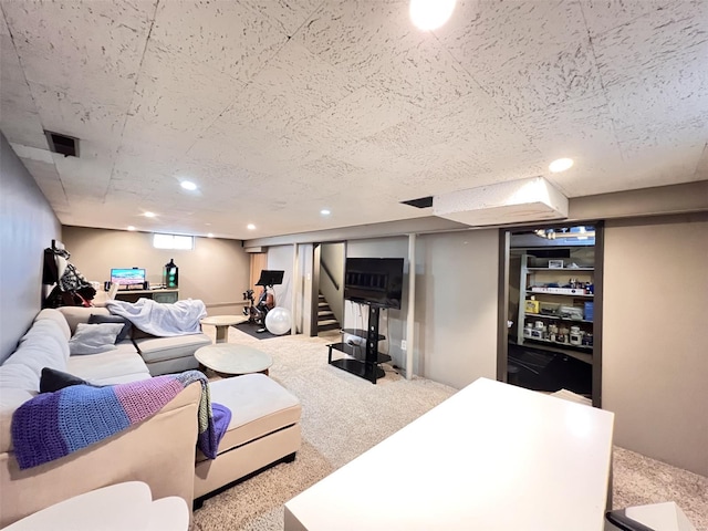 living area with recessed lighting, carpet, and stairs