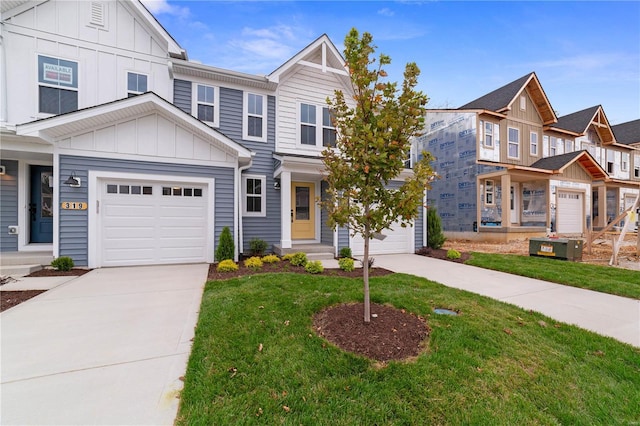 view of front of house featuring board and batten siding, a front yard, and concrete driveway