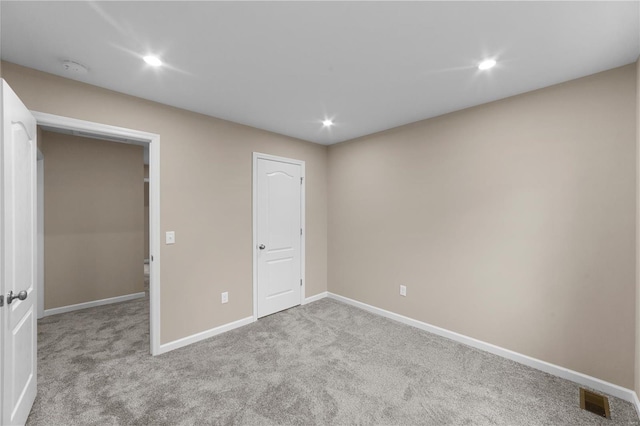 unfurnished bedroom with visible vents, carpet flooring, baseboards, and recessed lighting