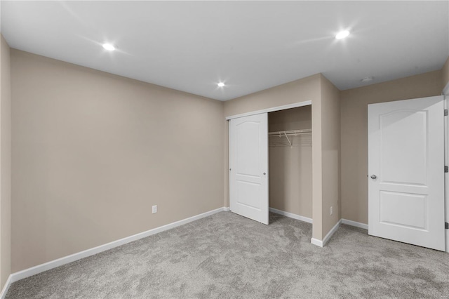 unfurnished bedroom featuring carpet flooring, recessed lighting, and baseboards