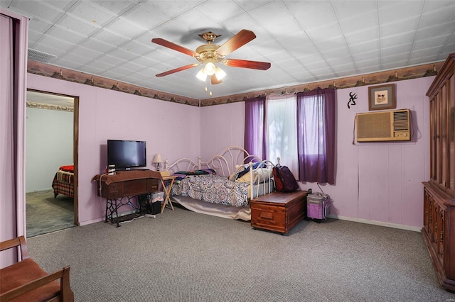 carpeted bedroom with baseboards, a ceiling fan, and visible vents