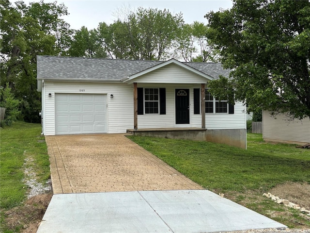 single story home featuring a garage, covered porch, decorative driveway, and a front yard