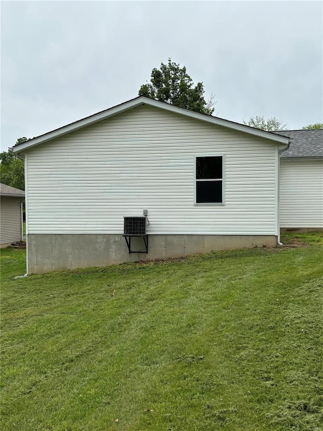 view of property exterior with a lawn
