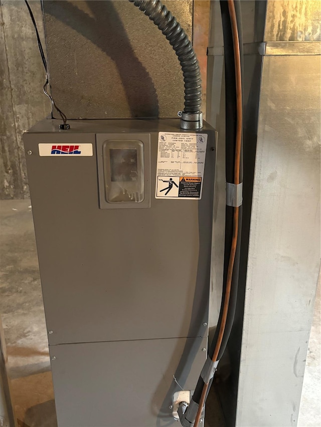 utility room featuring heating unit