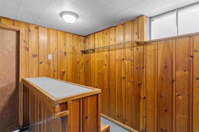 interior space featuring wooden walls