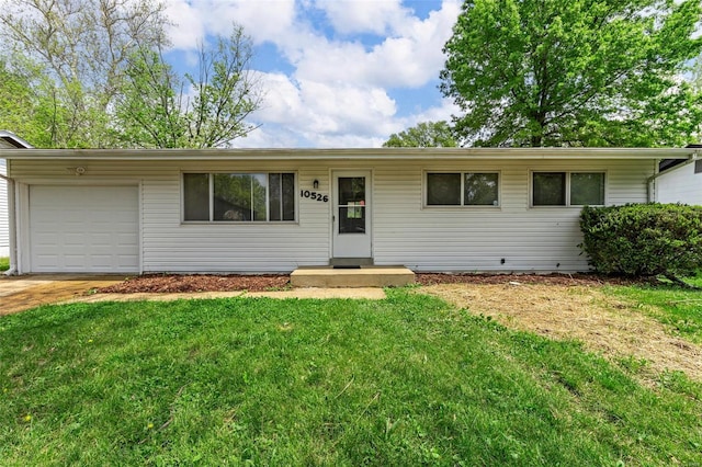 single story home with a garage, driveway, and a front lawn