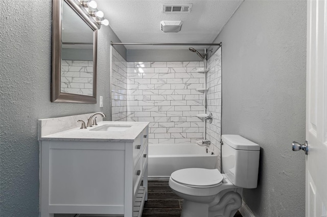 full bath featuring a textured wall, toilet, a textured ceiling, and visible vents