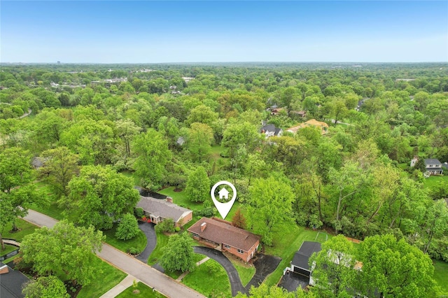 aerial view featuring a wooded view