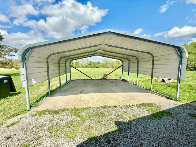 view of parking / parking lot featuring a detached carport and driveway