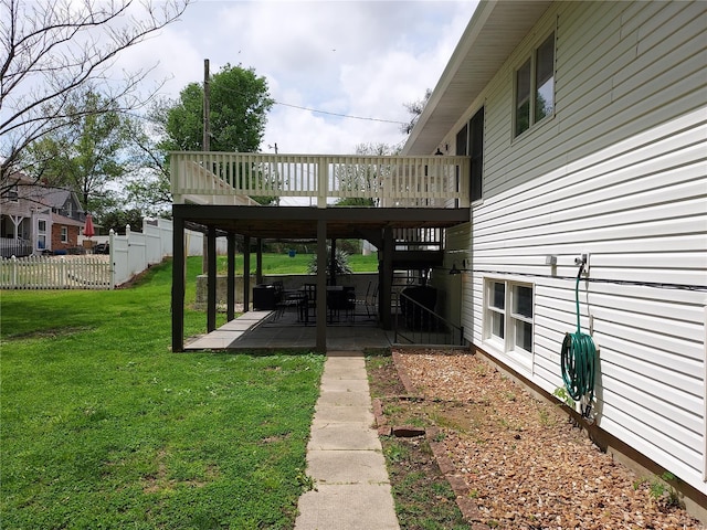 view of yard with fence, a patio, stairs, and a deck