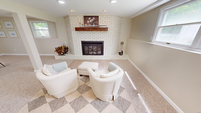carpeted living room with recessed lighting, baseboards, and a fireplace