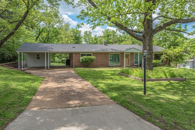 ranch-style home with driveway, brick siding, a front yard, and a carport